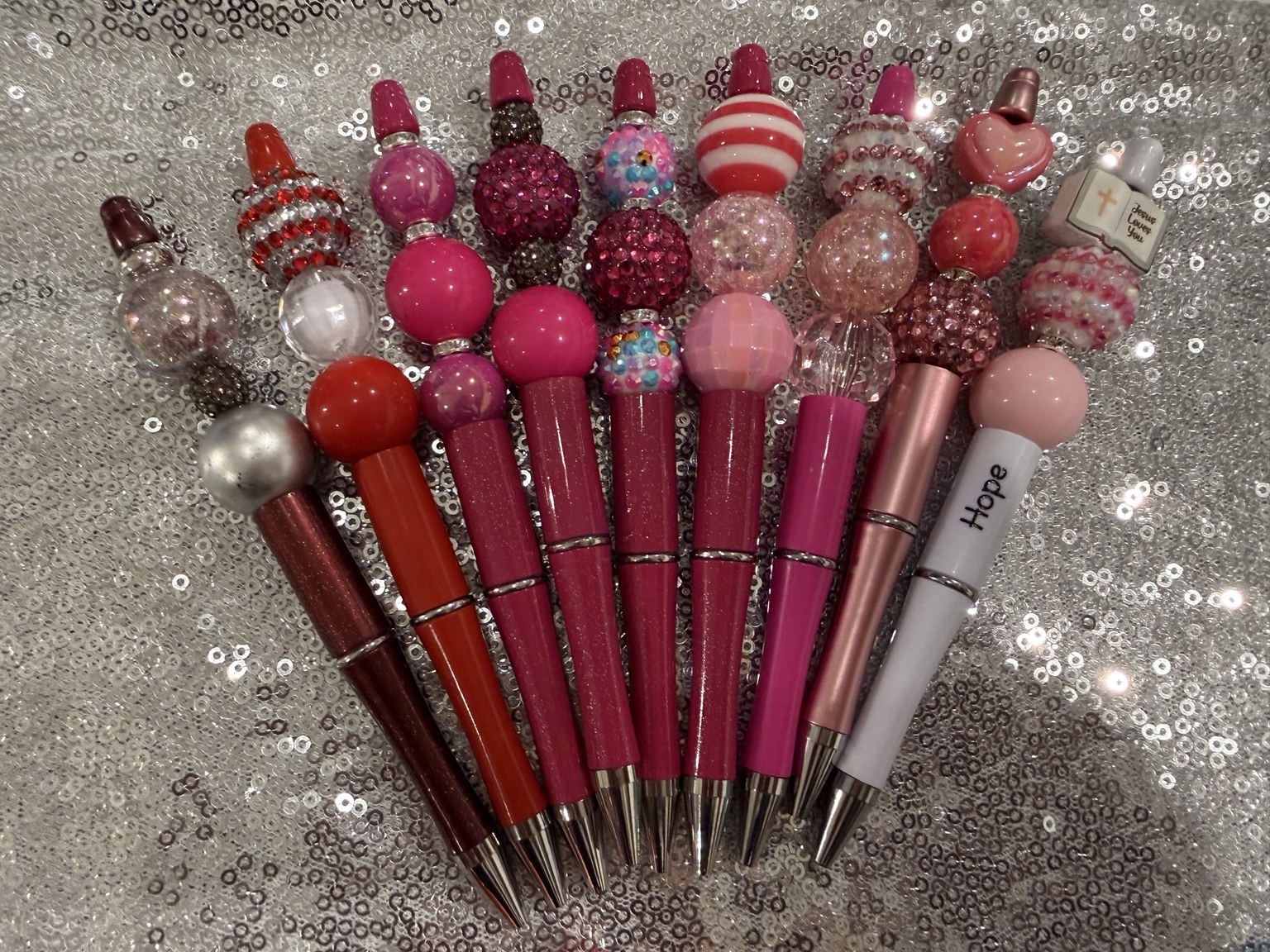 Complete collection of pink and red handmade beaded pens